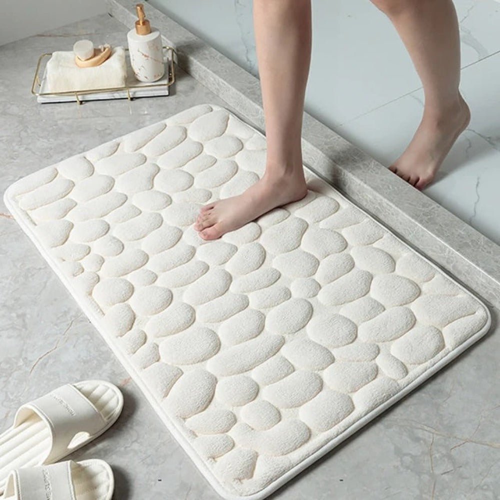 Antislip badmat met reliëfpatroon van kasseien
